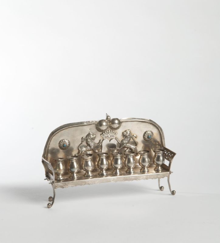 Hanukkah lamp with crowned Tablets of the Law flanked by lions