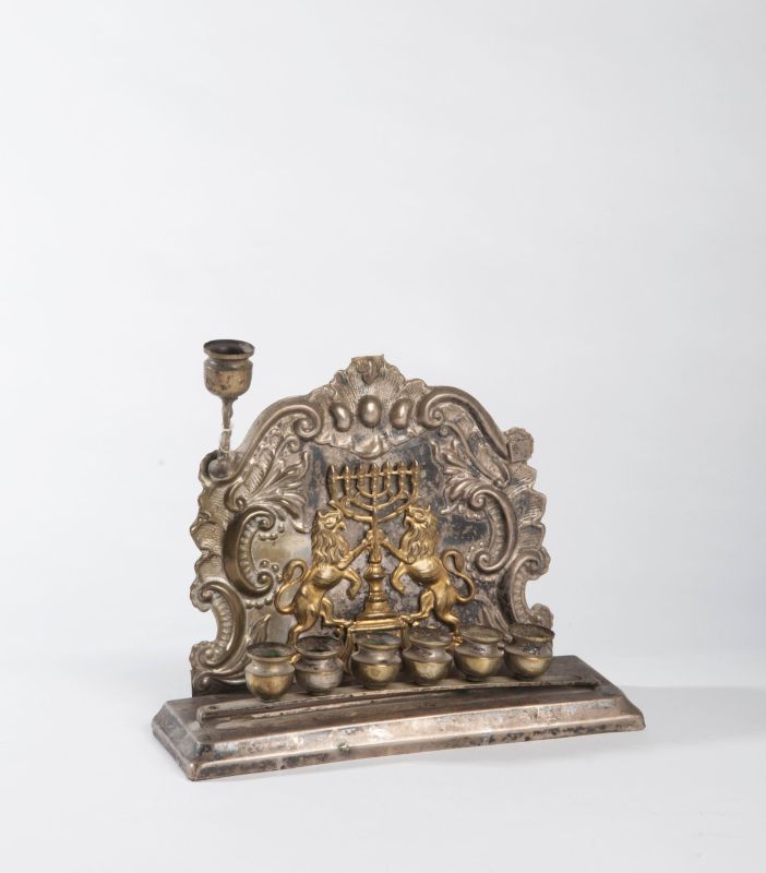 Hanukkah lamp with gilt menorah flanked by lions