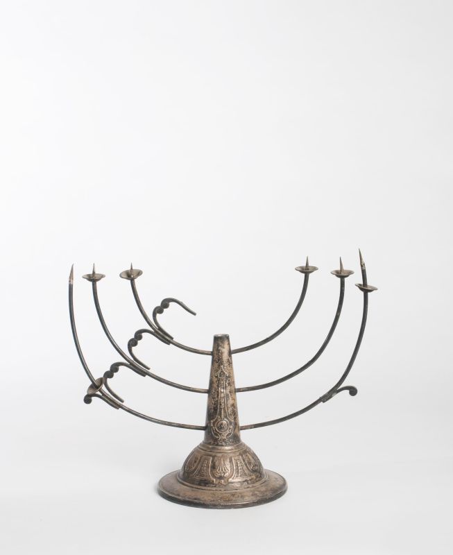 Damaged Hanukkah lamp with missing parts