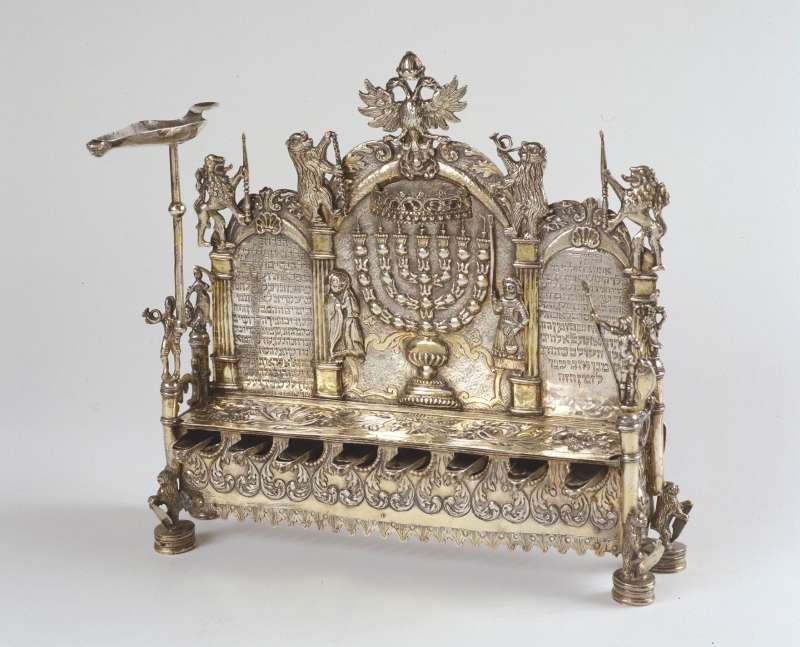 Hanukkah lamp inscribed with blessings, and adorned with warriors, lions, and bears