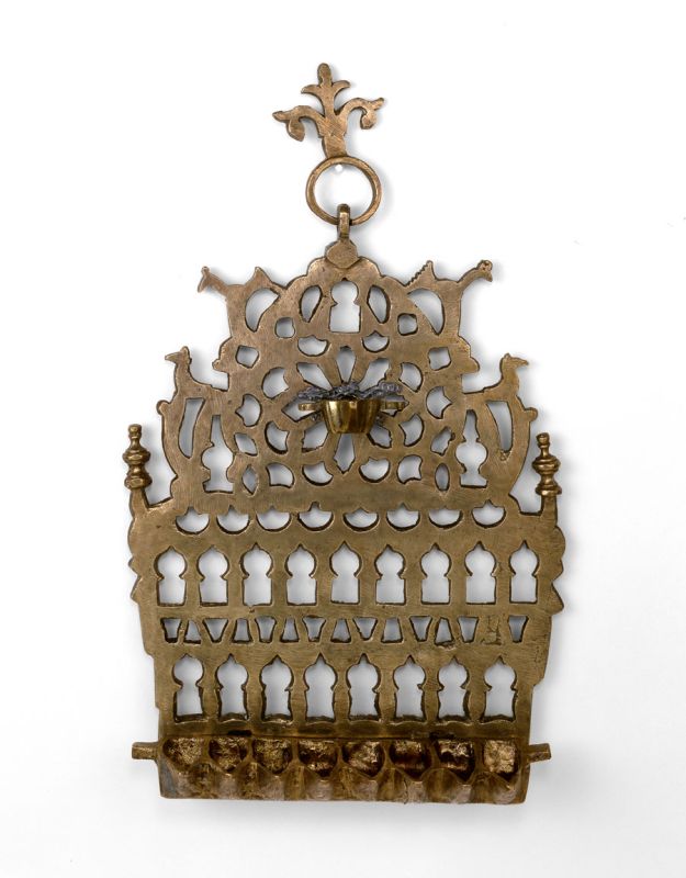 Hanukkah lamp adorned with rows of arched pointed windows