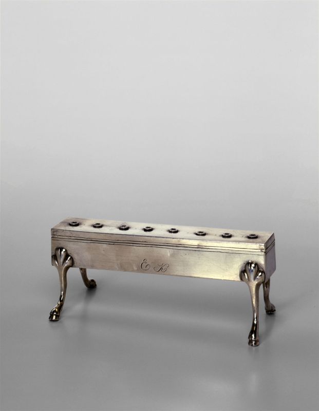 Hanukkah lamp shaped like a rectangular box with eight inner compartments