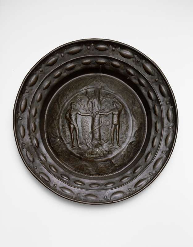 Plate adorned with the scene of Eve offering the apple to Adam