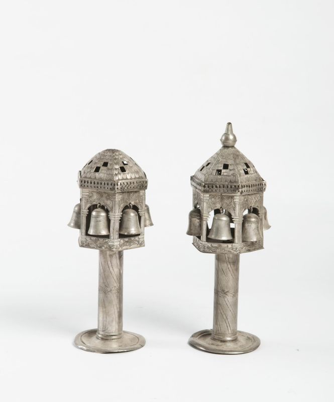 Tower-shaped Torah finials with tiled roofs