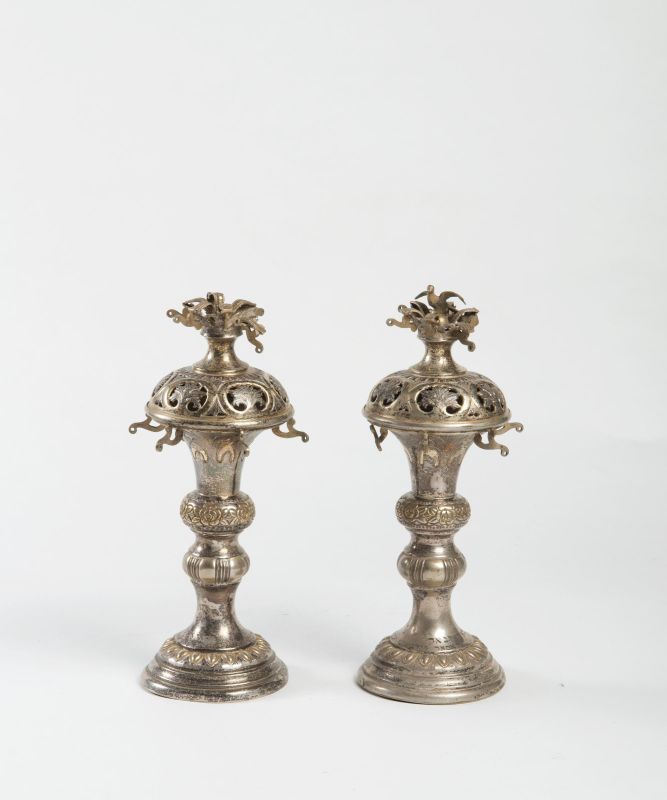 Torah finials with dedicatory inscription, decorated with a bird, roses, and leaves