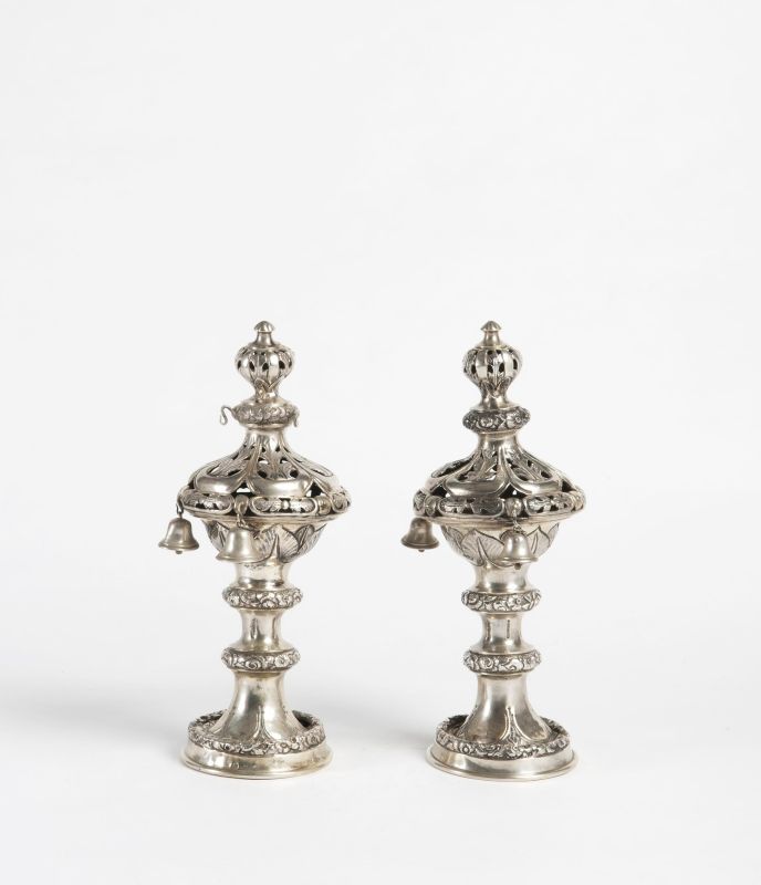 Torah finials decorated with flowers and leaves