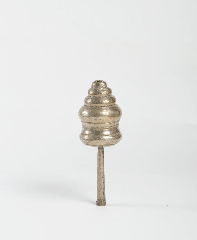 Torah finial decorated with garlands of flowers and a Hebrew inscription