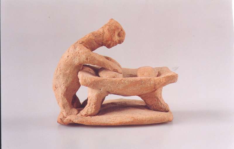 Figurine of a woman baking