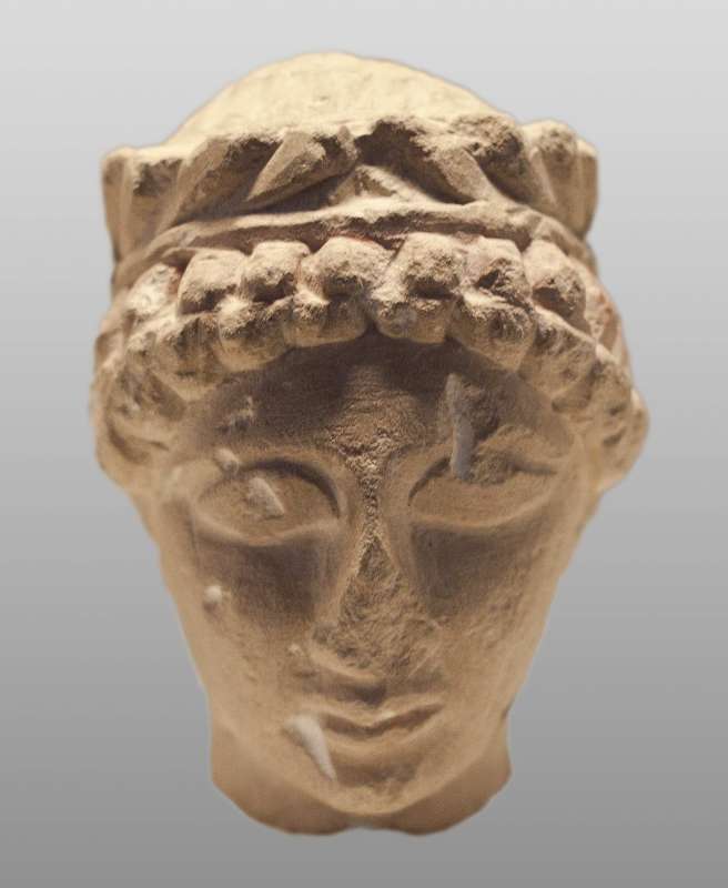 Head of male figurine with crown