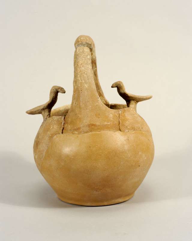 Vessel with a basket handle decorated with two birds of prey