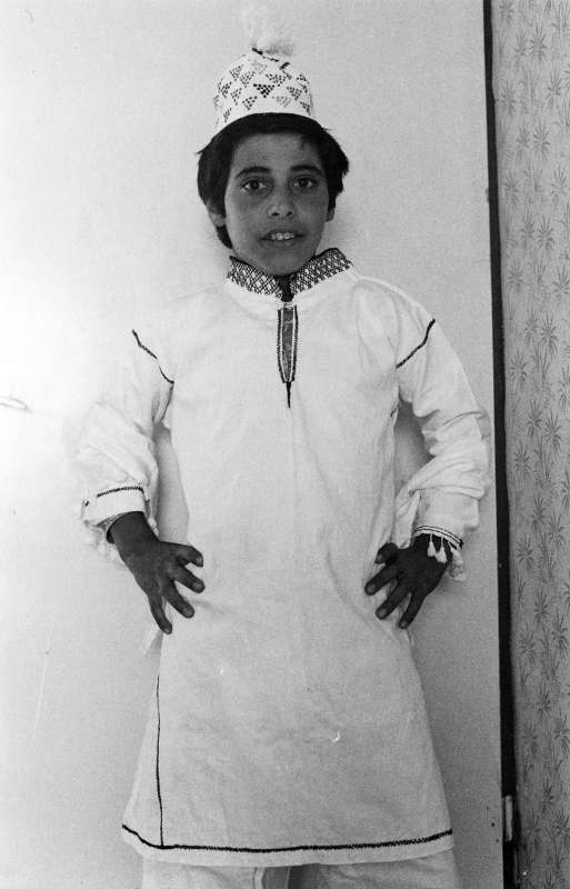 Boy wearing an embroidered outfit in the style of Aqra, Iraqi Kurdistan