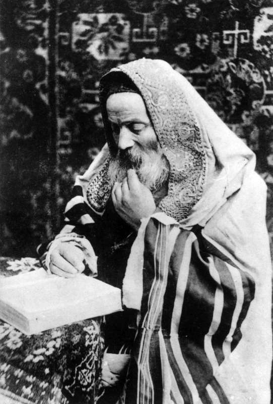 Ashkenazi Jew wrapped in a prayer shawl with <i>shpanyer</i>-work neckband