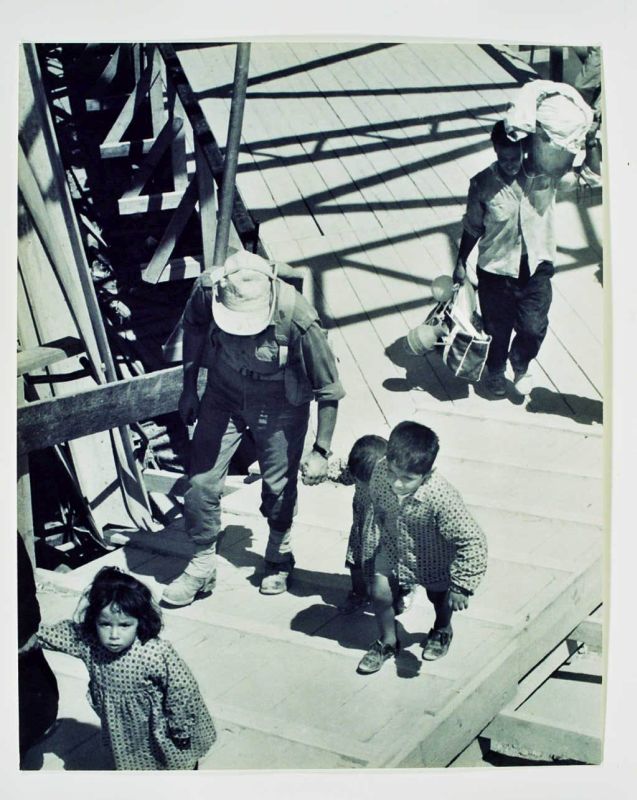 Soldier Holding Child by Hand and Arabs on Jordan Bridge
