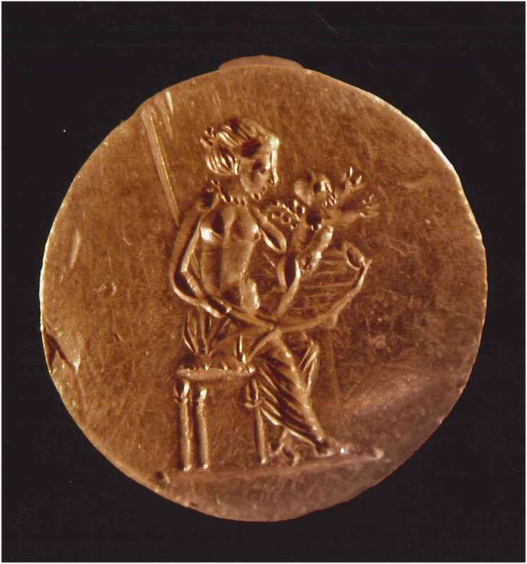 Finger ring depicting seated Aphrodite holding Eros