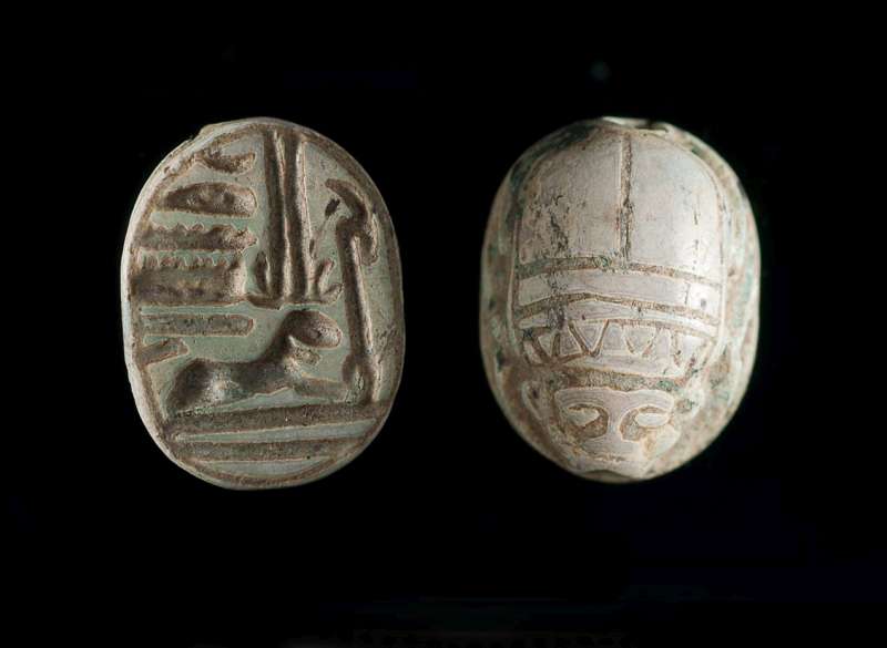 Human face scarab depicting a ram-headed sphinx representing the god Amun