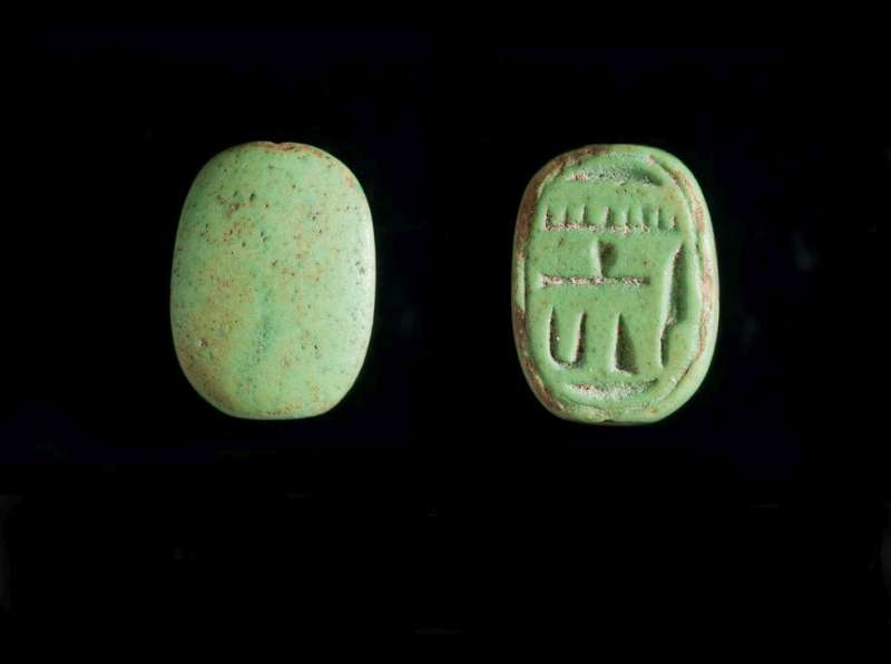 Oval scaraboid inscribed with the name Amenhotep and a couple of unclear signs