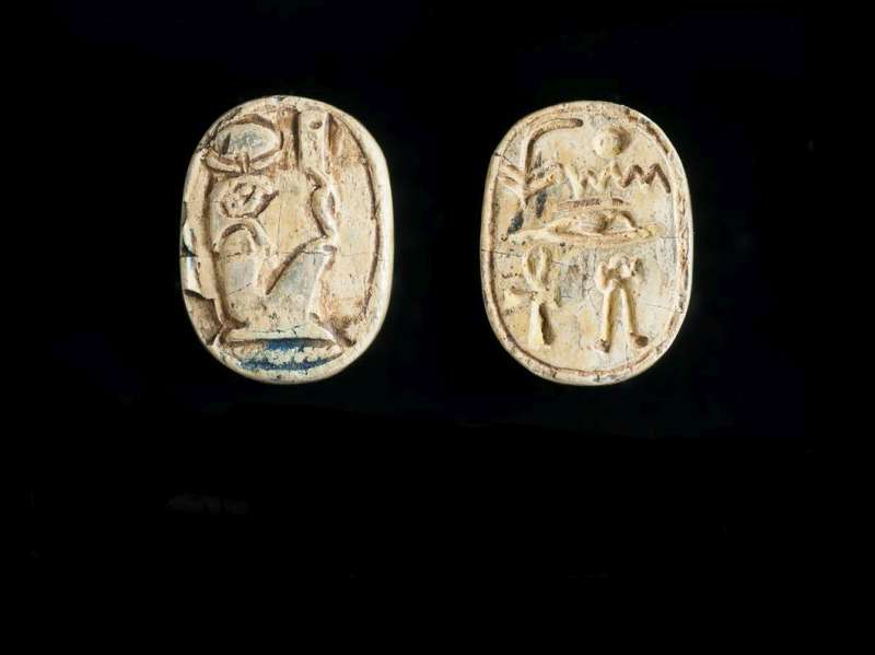Oval plaque depicting the falcon-headed god Khonsw on one side, and inscribed with a blessing 
