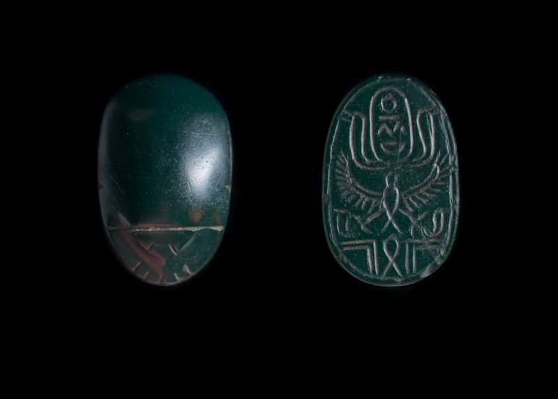 Canaanite scarab depicting a falcon with spread wings and a variation of the 