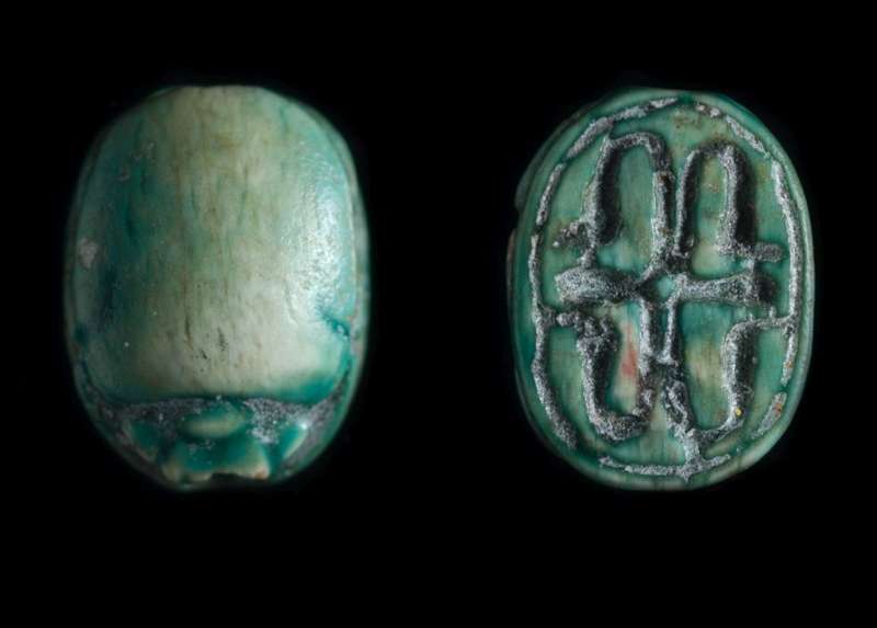 Scarab depicting a cross pattern with four uraei