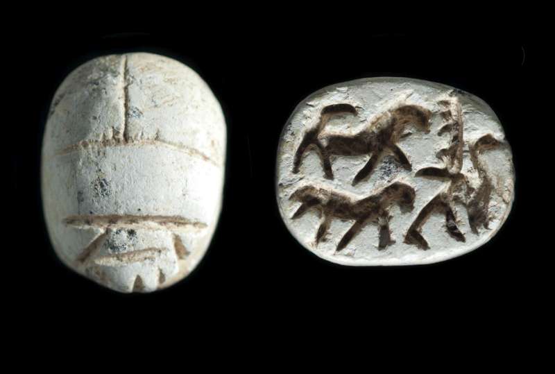 Scarab depicting a lion-hunting scene