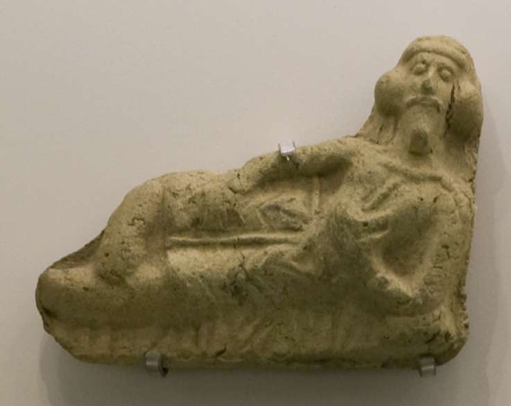 Plaque depicting a Parthian manseated in banquet posture