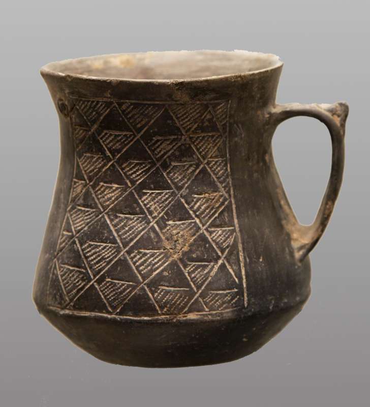 Cup with incised geometric decoration