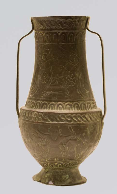 Vessel portraying a goddess holding date palms and a god subduing animals