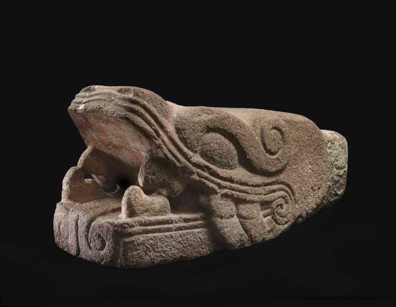 Colossal serpent-head sculpture