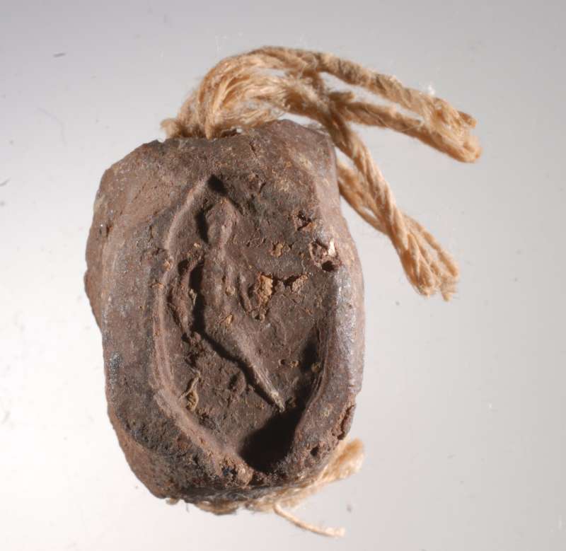 Seal impression (bulla) that sealed an Aramaic papyrus document